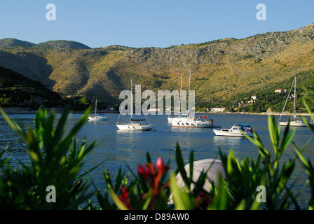 CROATIA. Boats in Zaton Bay near Dubrovnik, with the village of Zaton Mali in the distance. 2010. Stock Photo