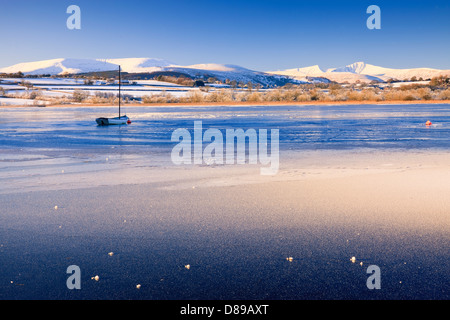 Llangorse Lake Brecon Beacons Powys Wales in winter with Pen y Fan & Corn Du mountains Stock Photo