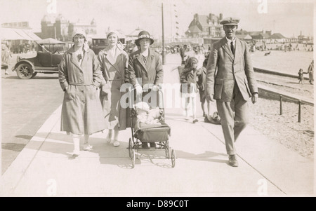 Family strolling along sea front with baby, 1930s Stock Photo