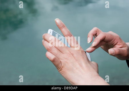 woman hands using smartphone Stock Photo