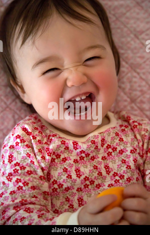 One year old girl making a funny face Stock Photo