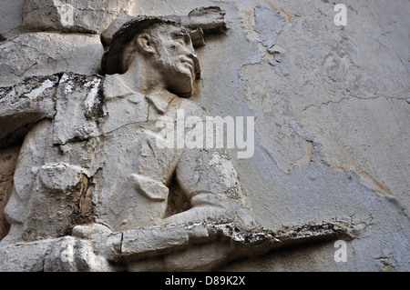 Soldier with broken bayonet on weathered wall exterior. Stock Photo