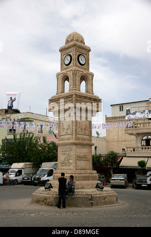 Clocktower in Midyat, southeastern Turkey, with both symbols of christinaity and islam Stock Photo