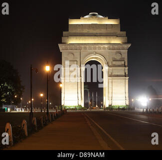 The India Gate (officially 'All India War Memorial') illuminated at night, is a triumphal arch in the Indian capital New Delhi. The 42 meter high arch was designed by Edwin Lutyens in 1921, modeled on the Arc de Triomphe in Paris. Stock Photo