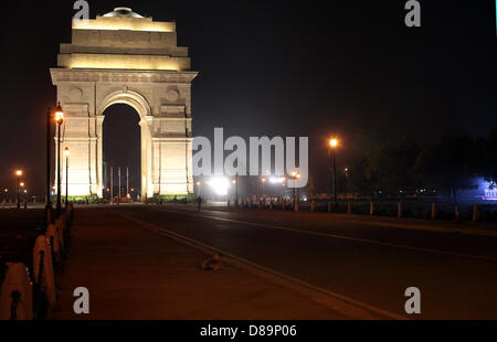 The India Gate (officially 'All India War Memorial') illuminated at night, is a triumphal arch in the Indian capital New Delhi. The 42 meter high arch was designed by Edwin Lutyens in 1921, modeled on the Arc de Triomphe in Paris. Stock Photo