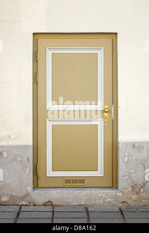 Old wooden door with square elements in old building facade. Tallinn, Estonia Stock Photo