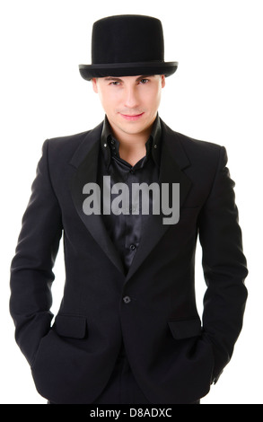 Young attractive man in black suit and hat in austere style isolated on white background Stock Photo