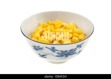 Canned corn in ceramic bowl on white Stock Photo