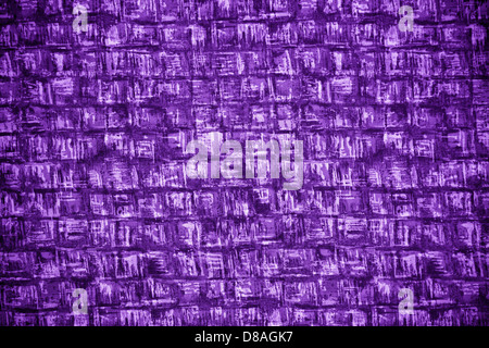 An abstract close-up of purple fabric featuring square patterns and textured surfaces. The image highlights the fabric's rich color and intricate design. Stock Photo