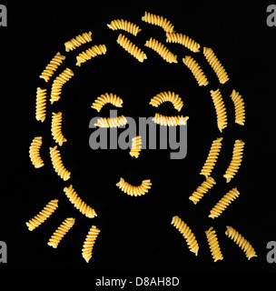 Face of pasta fusilli on black background Stock Photo