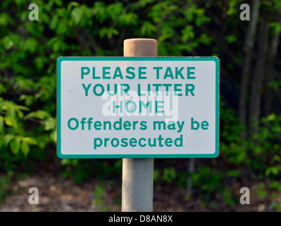 'PLEASE TAKE YOUR LITTER HOME'. Offenders may be prosecuted', notice in duel-carriageway layby. Stock Photo