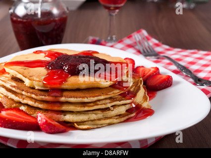 Selective focus on the strawberries jan on top of pancake Stock Photo