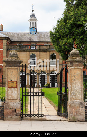 Path and gates at entrance to Adams' Grammar School for boys founded 1656 by William Adams in Newport, Shropshire, West Midlands, England, UK