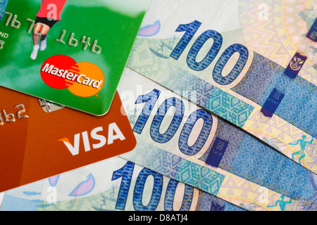 A Visa and Master Card with South African rands currency Stock Photo