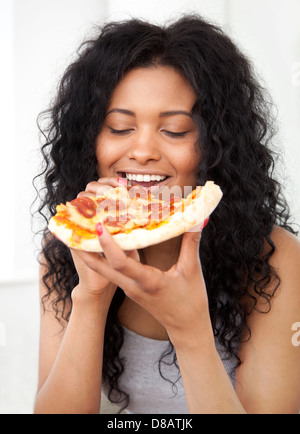 Woman eating pizza Stock Photo