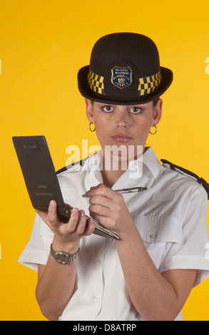 Portrait of Traffic Warden issuing a parking ticket. Stock Photo