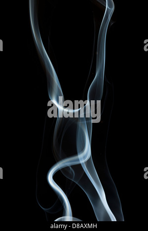 Whispy White Smoke against a black background Stock Photo - Alamy