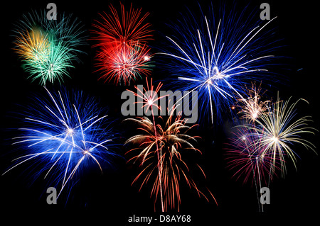 Fireworks of various colors bursting against a black background Stock Photo