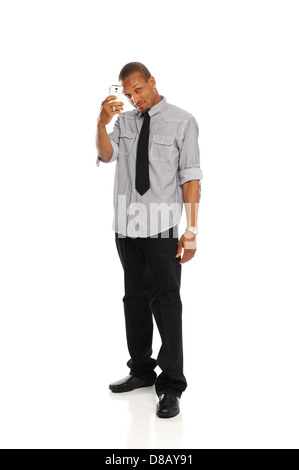 Young Black Man holding a cell phone isolated on a white background Stock Photo