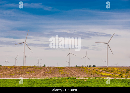 Wind Generators, Ecology. Wind turbine generating green energy in agriculture fields Stock Photo