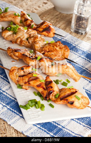 Roasted Chicken Kebab on a wooden skewer Stock Photo