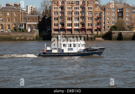 The 'Barnes', a Port of London Authority harbour master boat sailing on the River Thames, London, UK. Stock Photo