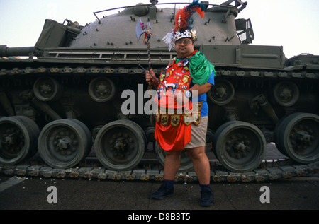 Obese Jewish man covered with Israeli military unit badges and plastic gun posing during Purim festival in Israel Stock Photo