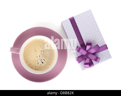 Violet coffee cup and gift box with bow. View from above. Isolated on white background Stock Photo