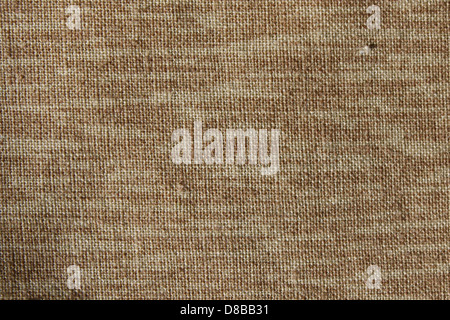 A close-up image of brown woven fabric, showcasing its texture and intricate weave. The fabric's natural pattern and earthy tones are highlighted, making it suitable for textile or design purposes. Stock Photo