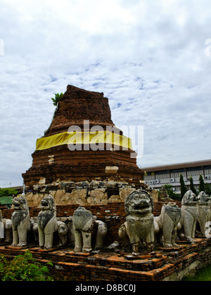 An ancient buddhist pagoda with elephant stone statues in Ayutthaya in Thailand Stock Photo