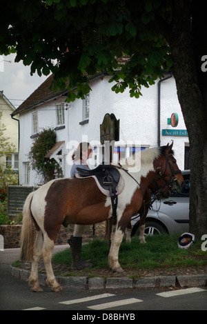 Kentisbeare village centre, Devon with ponies, village stores and post office Stock Photo