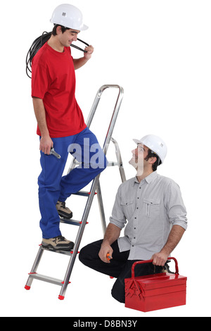 Team of electricians on white background Stock Photo