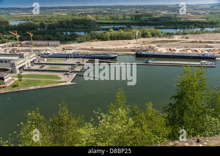 Belgium. Barges sail through a canal lock at the Albert canal, viewed from Fort Eben Emael Stock Photo