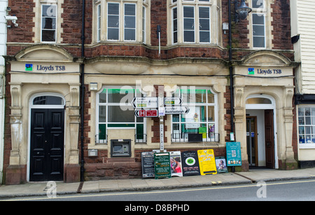 Ashburton, Devon, England. Lloyds TSB bank at Road signs to various Devon destinations. Stock Photo