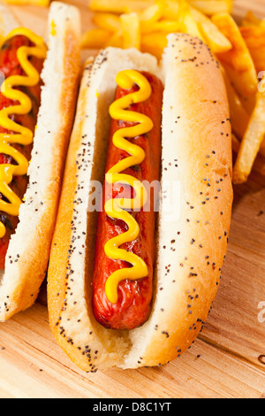 Organic All Beef Hotdog on a bun with mustard Stock Photo