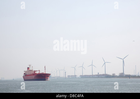 windmills and oil tanker in Nieuwe Waterweg near port of Rotterdam in The Netherlands Stock Photo