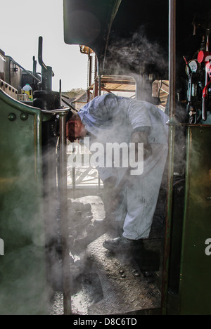 Fireman on a steam train in Llangollen a small town and community in Denbighshire, north-east Wales Stock Photo