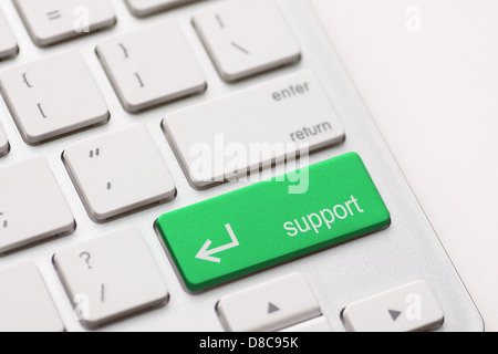 A computers support key on white keyboard Stock Photo