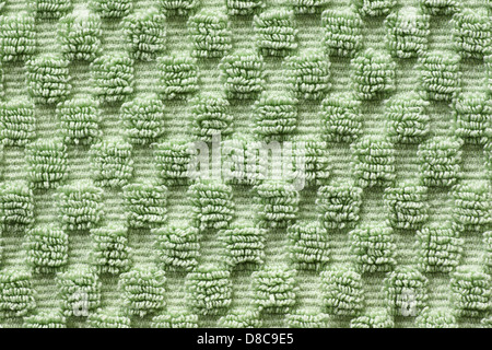 Macro shot of soft green towel with square pattern, green texture and background. Stock Photo