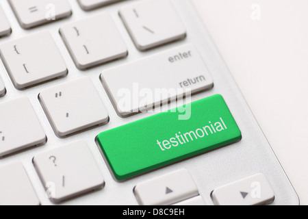 Testimonial button key on white keyboard. Stock Photo