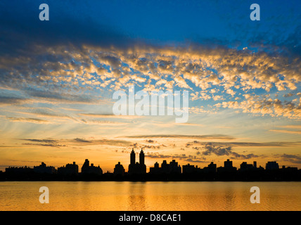 Silhouette of Central Park West skyline and El Dorado Apartment Building, the reservoir, Central Park, Manhattan, New York City. Stock Photo