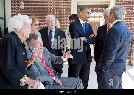 US President Barack Obama and First Lady Michelle Obama talk with former Presidents and First Ladies before a luncheon at the George W. Bush Presidential Library and Museum on the campus of Southern Methodist University April 25, 2013 in Dallas, Texas. Pictured, from left, are: Barbara Bush, George H.W. Bush, Rosalynn Carter, Jimmy Carter, Hillary Rodham Clinton, Bill Clinton, and George W. Bush. Stock Photo