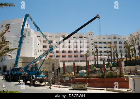 A large hotel in Bugibba Malta has construction work being carried out in its grounds Stock Photo