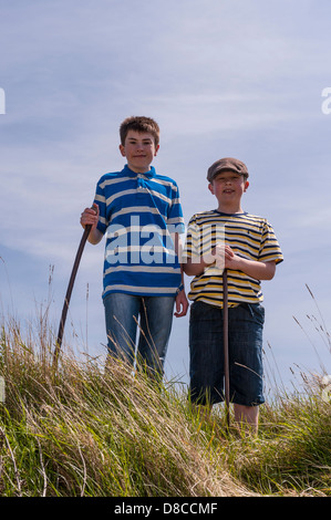 Two boys ( brothers ) age 9 and 13 on a country walk in the Uk Stock Photo