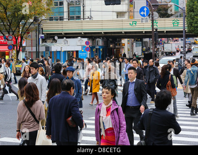 People crossing the street at the famous Shibuya crossing in Tokyo, Japan Stock Photo