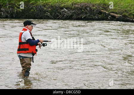 Boy fishing in willow creek. Stock Photo