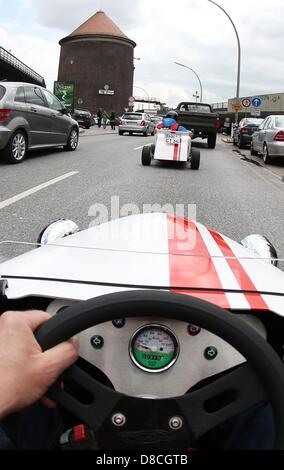 A vehichle from Hot Rod City Tour is driven on a short tour of the Landungsbruecken in the port of Hamburg, Germany, 23 May 2013. People can take tours of Hamburg in thes unusual motorised soap box cars. Photo: CHRISTIAN CHARISIUS Stock Photo
