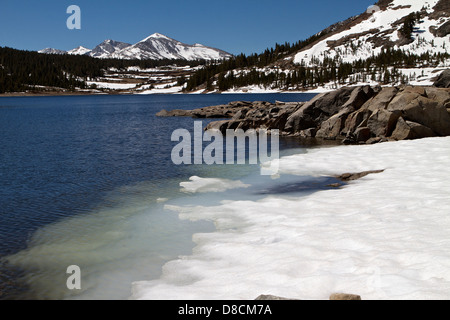 Ice receding on Tioga lake in the eastern Sierra Nevada mountains during the spring thaw