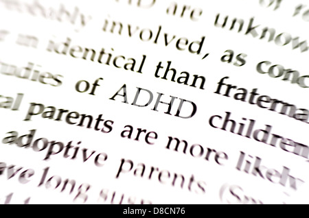 the word adhd in focus surrounded by blurred words Stock Photo