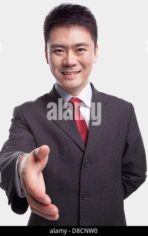 Businessman Extending His Hand Stock Photo